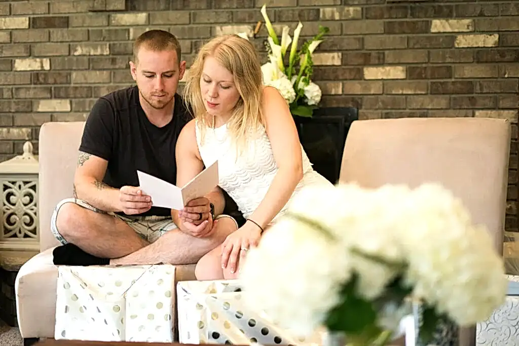 Engaged couple opens gifts at couples shower