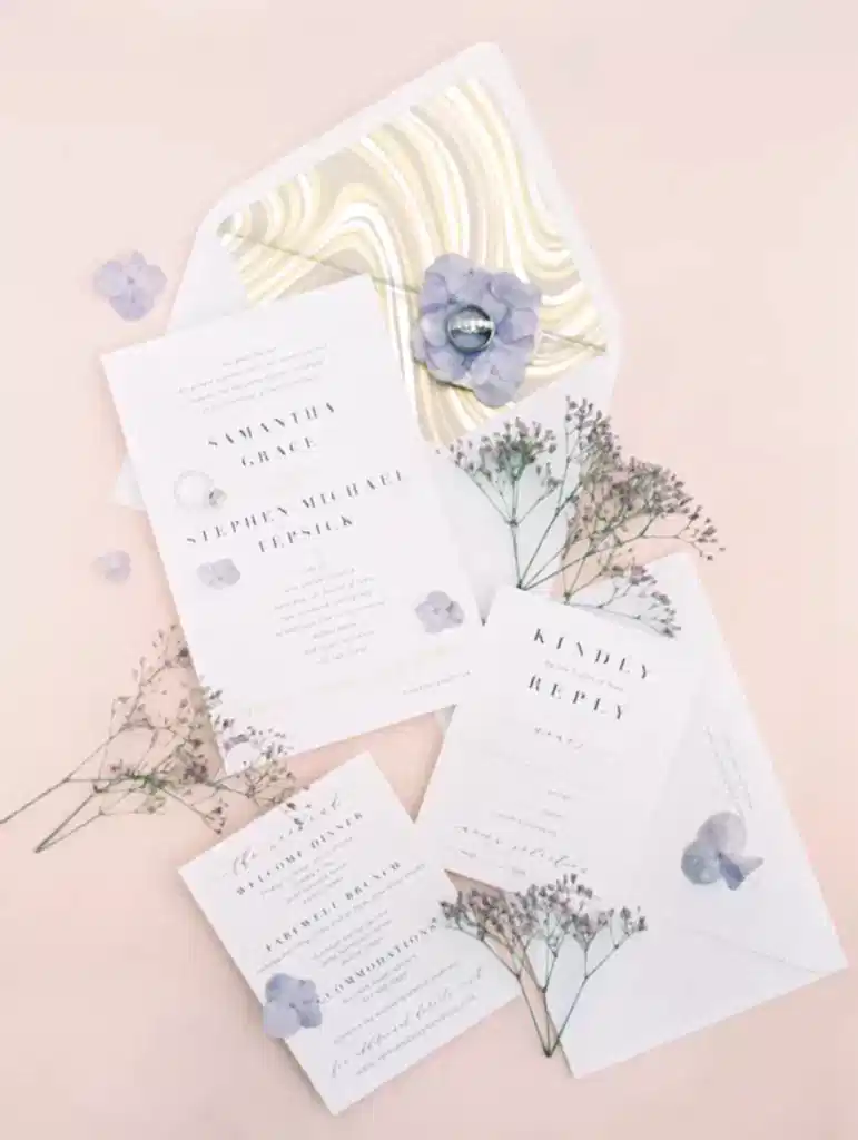 A photo with several cards of personalized stationary used for a wedding