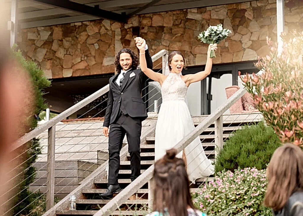 The bride and groom prepare to leave after their wedding reception is over